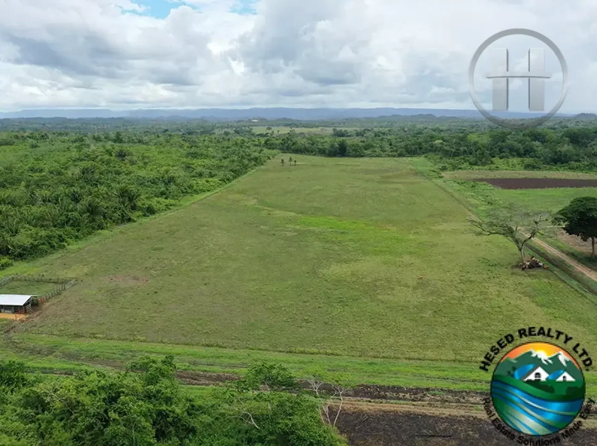 25-Acre Cleared Fenced Land with Pond Near Spanish Lookout, Cayo