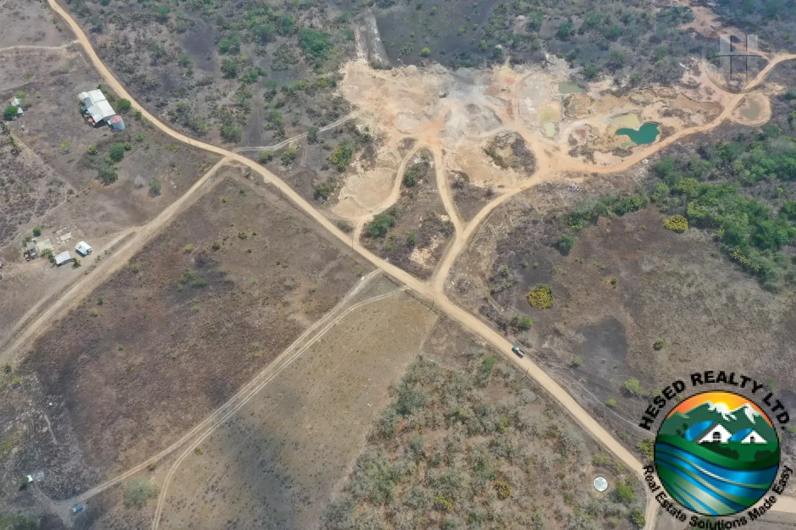 69-Acre Flat Parcel with Ponds and Gravel Reserves in Billy White, Cayo