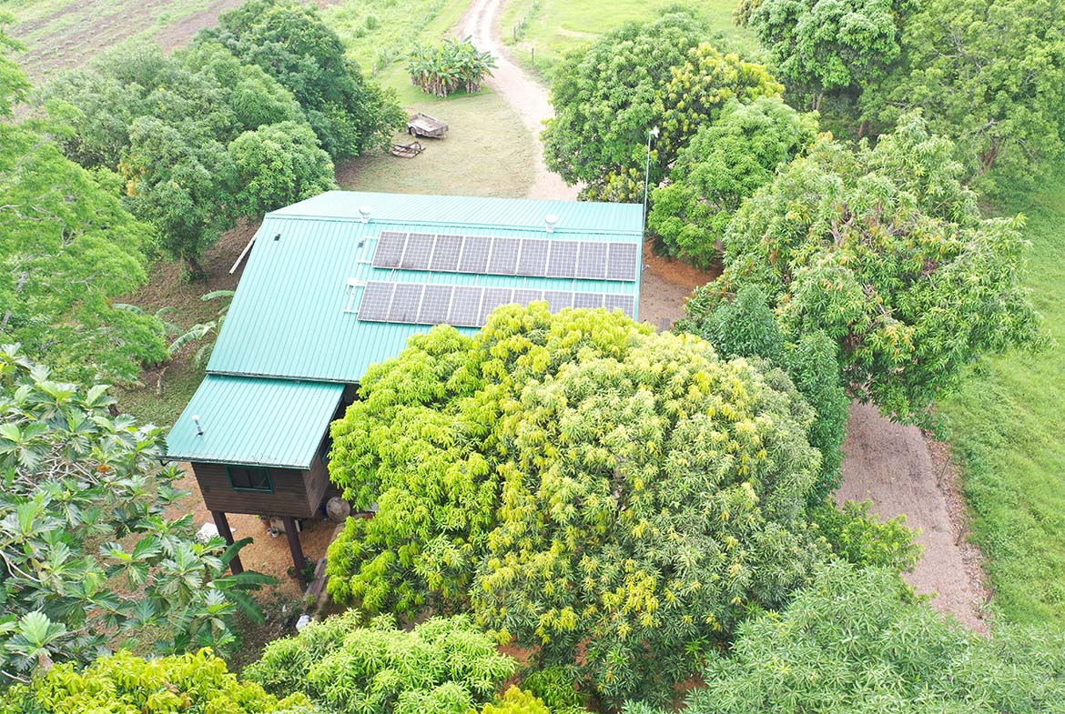 Aerial view of the house on the property.Showcasing Solar panels