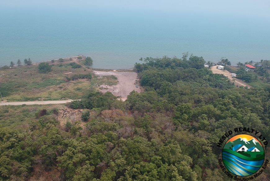 Aerial view of the 0.49-acre property in Commerce Bight, showing the road leading to the lot and the surrounding sea.