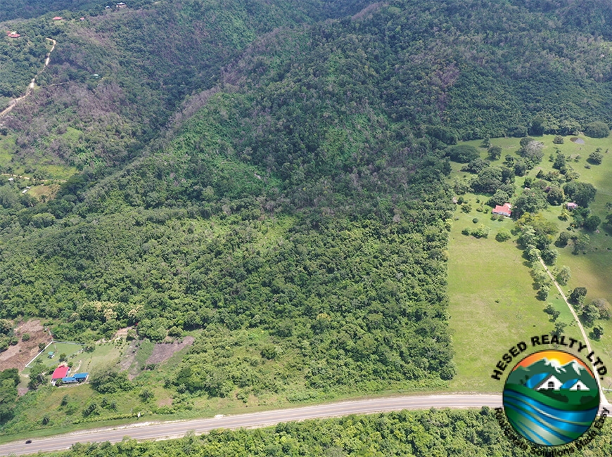 Elevated drone view of the hilltops on the 118-acre property in Georgeville, highlighting scenic vistas.