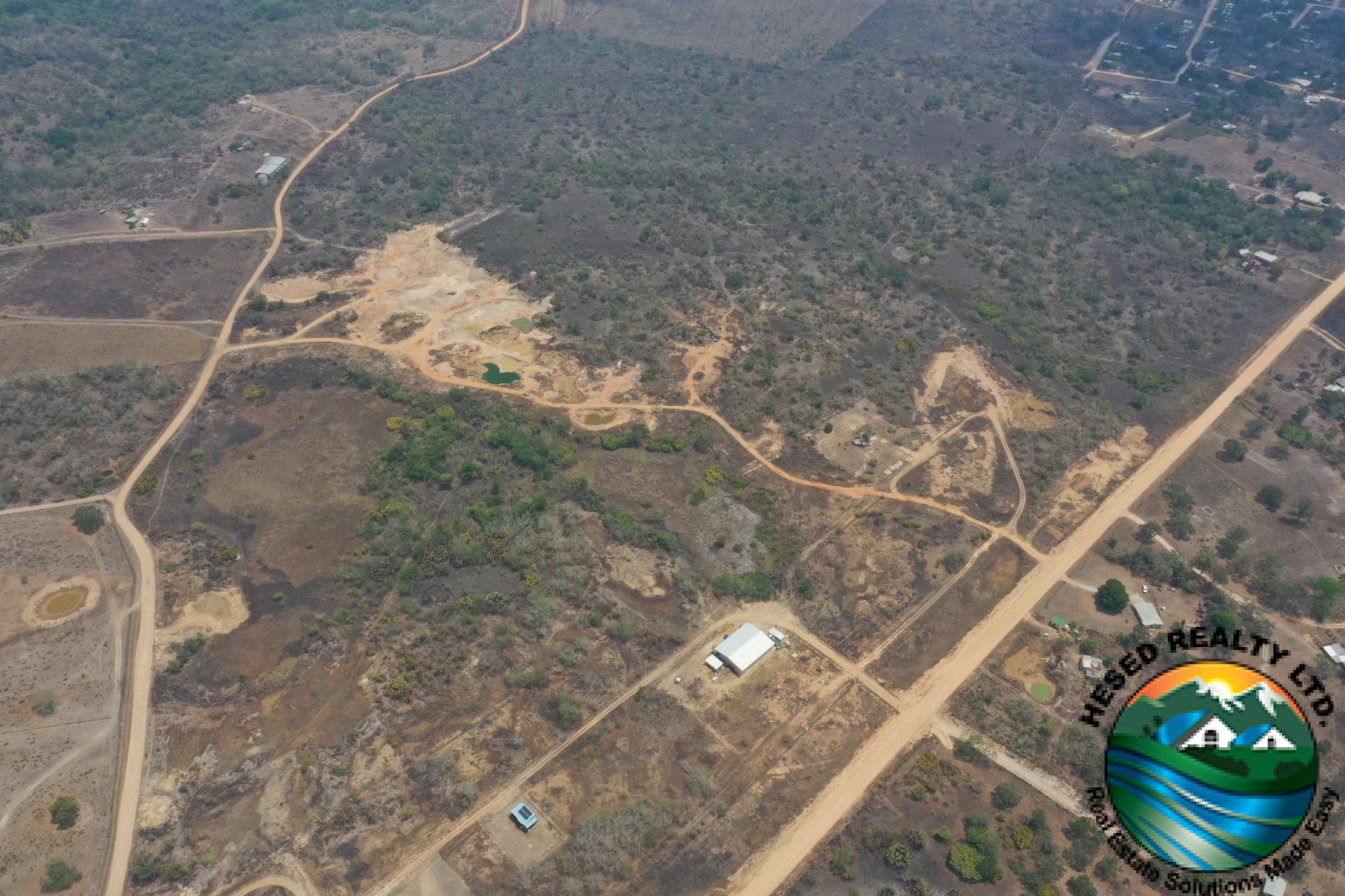 Aerial drone view of the 69-acre property and road access in Billy White, Belize.