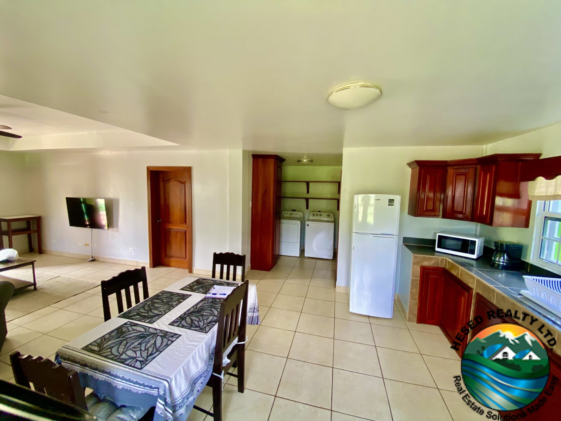 Wash area in 1-bedroom apartment in Belmopan with laundry hookup for tenant convenience.