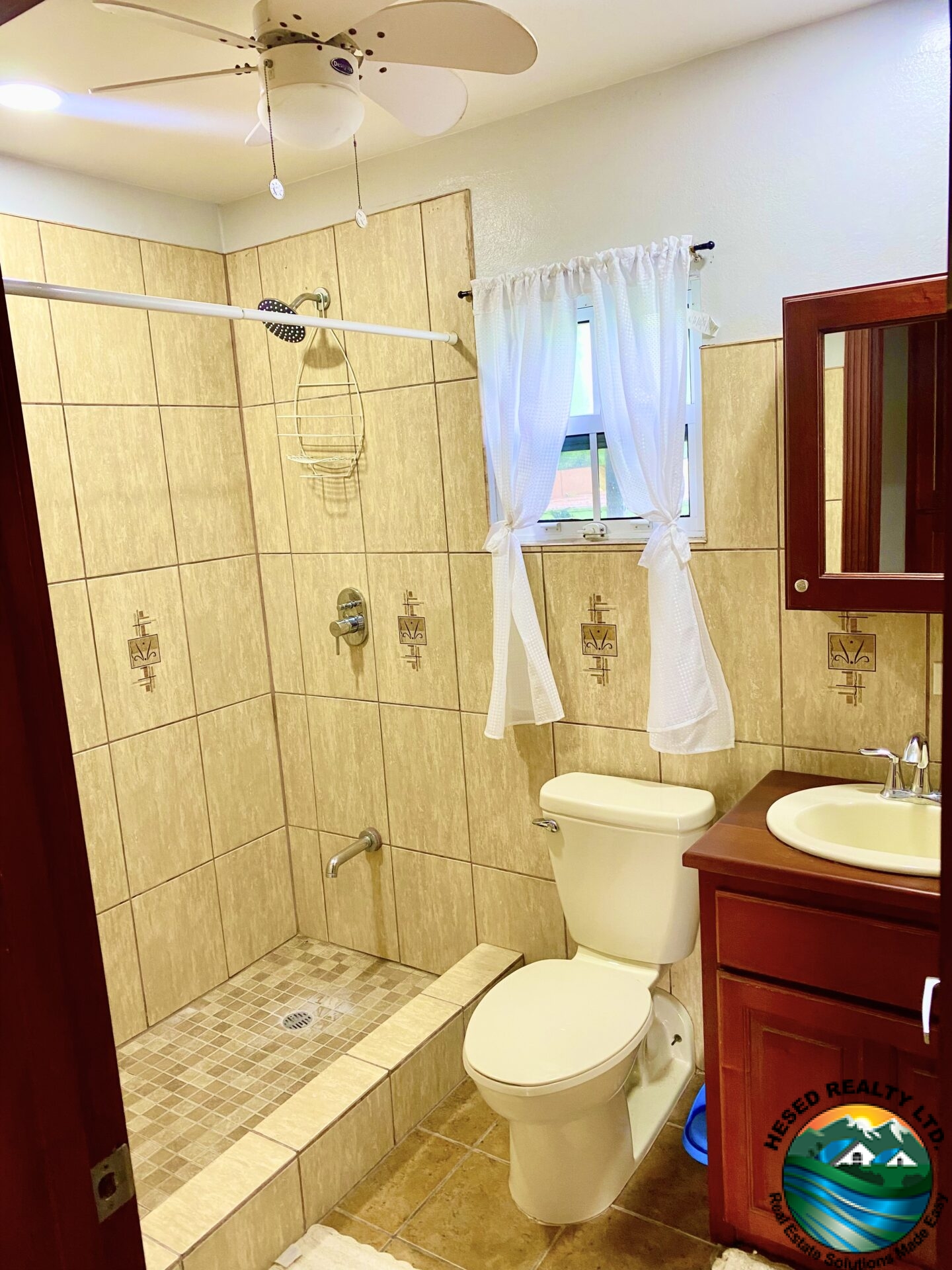 Modern bathroom in Belmopan apartment with updated fixtures and clean design.