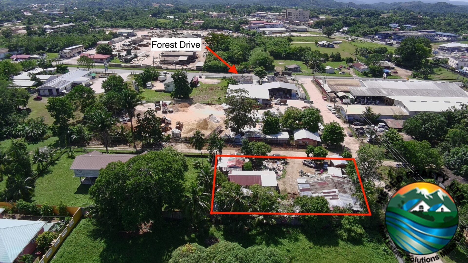 Full view of a commercial lot showcasing its proximity to Forest Drive in Belmopan.